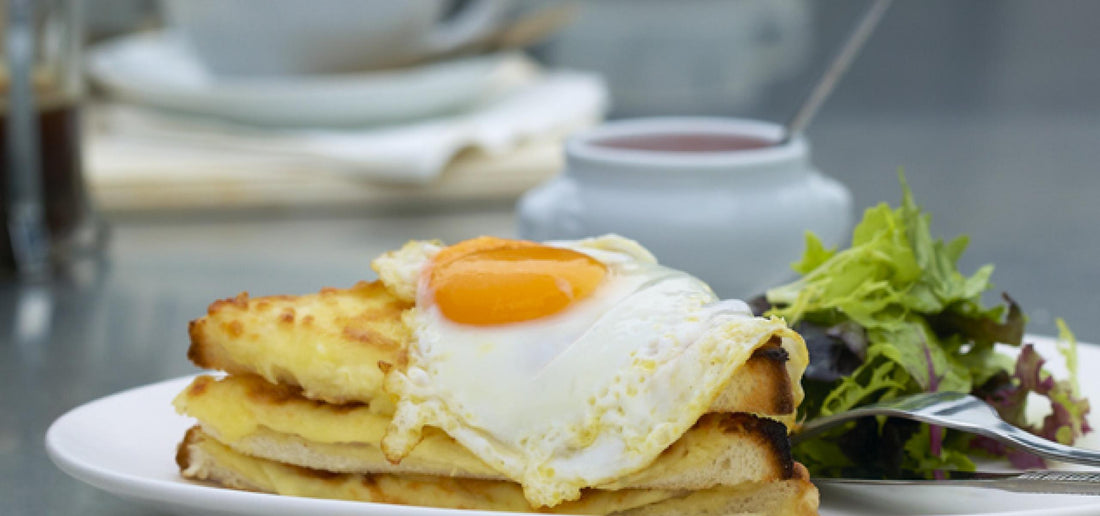 Croque madame Bitton style with salad and spicy tomato sauce